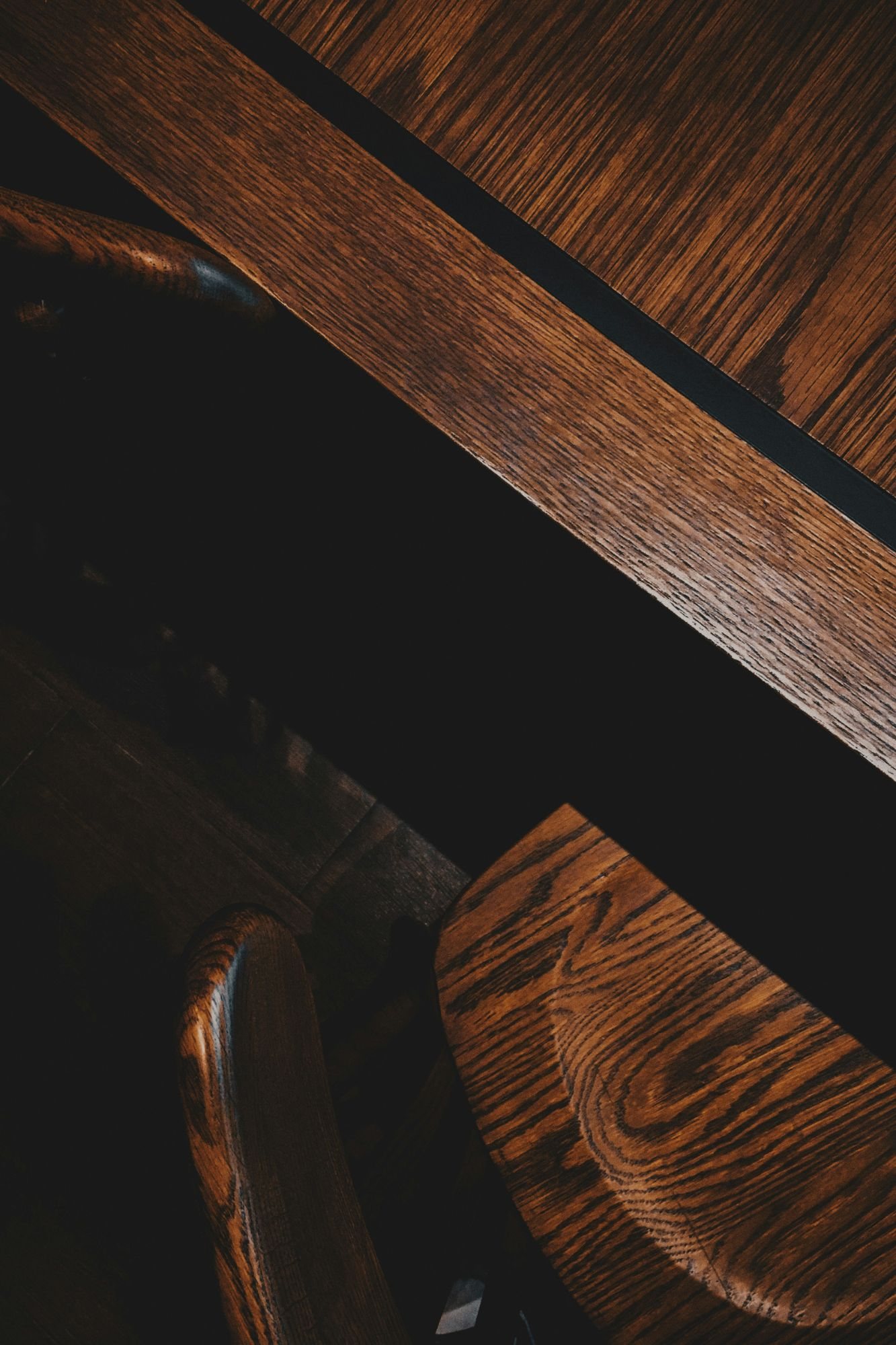 Detail of a solid-wood dining table and chair