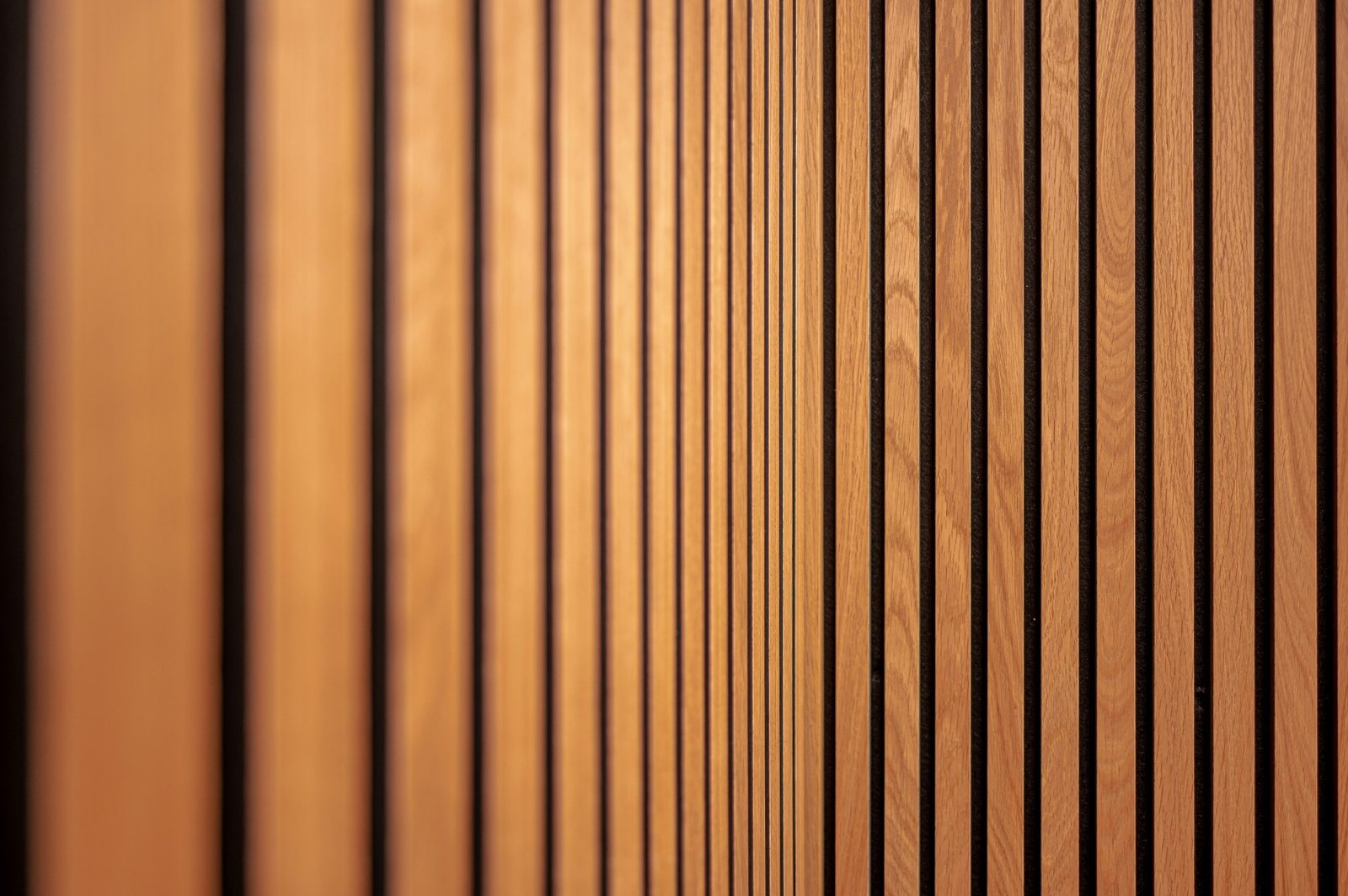 Close-up of vertical reclaimed-wood slat wall panelling